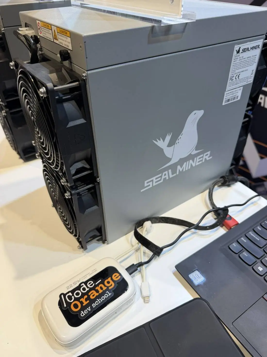 Close-up of Code Orange Bitcoin mining hardware